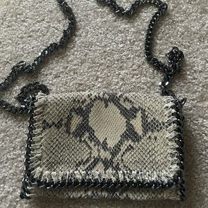 Made in Italy. Leather bag alligator skin with chrome chain and zipper